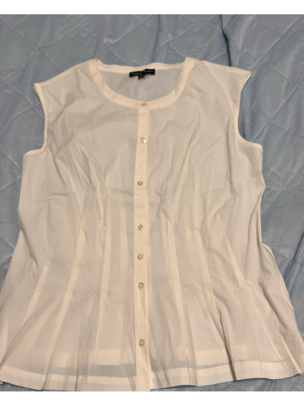 Sleeveless White Button-Front Pleated Blouse